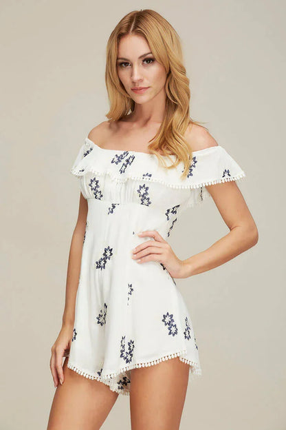 White Romper with Off-Shoulder Embroidery and Pom-Pom Trim